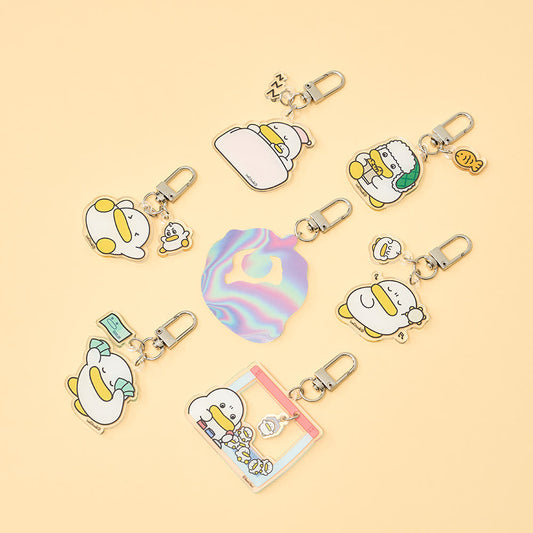 Collection of cartoon character keychains on a beige background